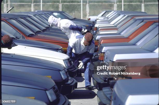 Rows of new Chrysler Colt cars on lot of Mitsubishi Sittipol Motors plant getting final inspection; cars are manufactured for Chrysler's Canadian...