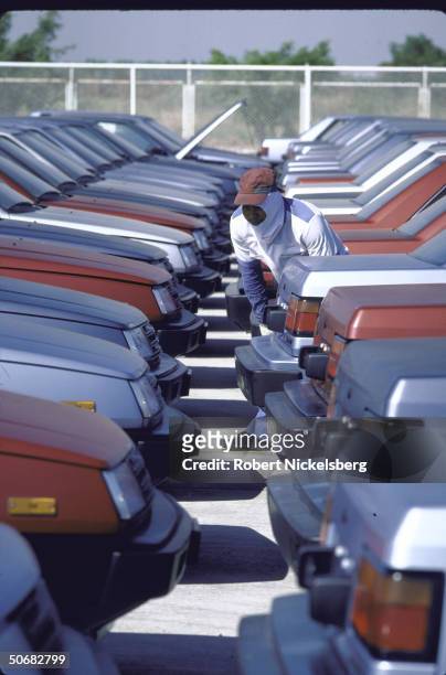 Rows of new Chrysler Colt cars on lot of Mitsubishi Sittipol Motors plant getting final inspection; cars are manufactured for Chrysler's Canadian...