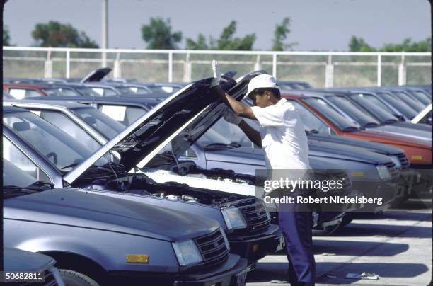 Rows of new Chrysler Colt cars on lot of Mitsubishi Sittipol Motors plant getting final inspection; cars are manufactured for Chrysler's Canadian...