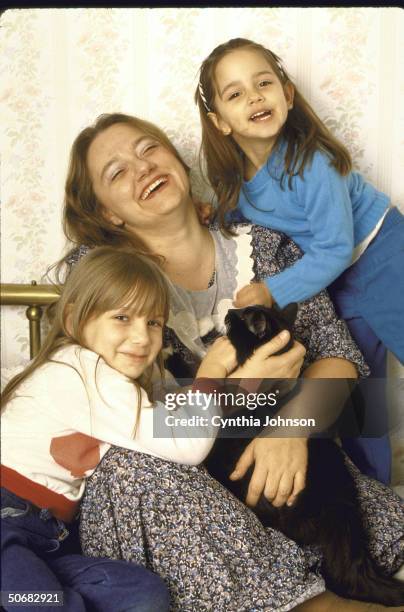 Soviet emigre Elena Balovlenkov, separated from her refusenik husband Yuri Balovlenkov since 1979, sitting at home with her children Masha and Katia .