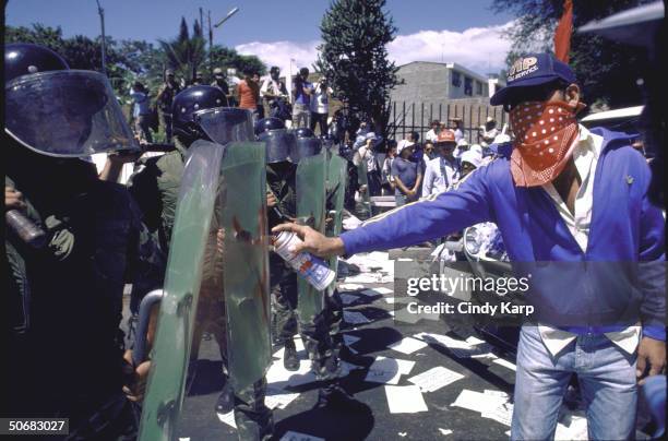 Riot control squad facing students, workers & peasants who are protesting assassination of Human Rights Comm. President Herbert Anaya Sanabria.