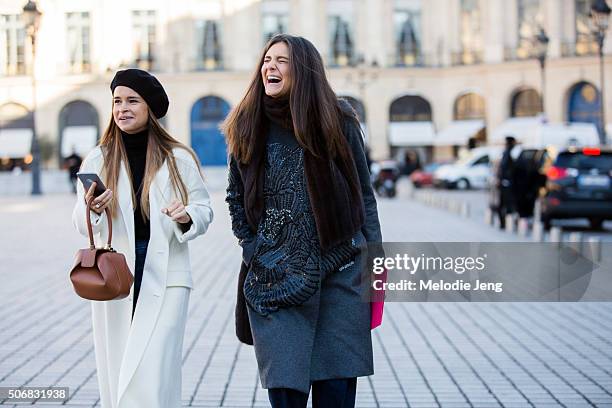 Miroslava Duma attends the Schiaparelli show in a white coat and black beret on January 25, 2016 in Paris, France.