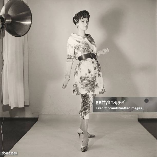 Model wearing a dress by Austrian fashion designer Gertrud Hoechsmann. 1956. Photograph by Barbara Pflaum . .