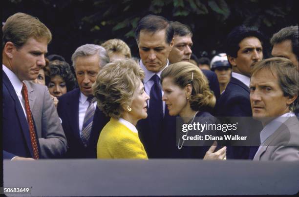 Nancy Reagan surrounded by secret servicemen embraces Mrs. Miguel de la Madrid Hurtado after viewing earthquake aftermath with US Amb. To Mexico John...