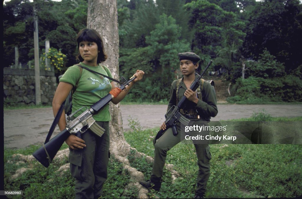 FMLN guerrilla boy and girl armed with r