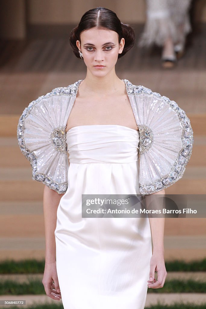 A model walks the runway during the Chanel Haute Couture Spring... News ...