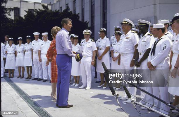 President Ronald W. Reagan with wife Nancy bidding farewell to staff at Bethesda Naval Hospital after his colon cancer surgery.