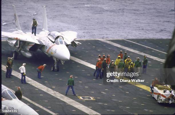Unidentified planes and air controllers on flight deck of USS America off coast of Ocean City.