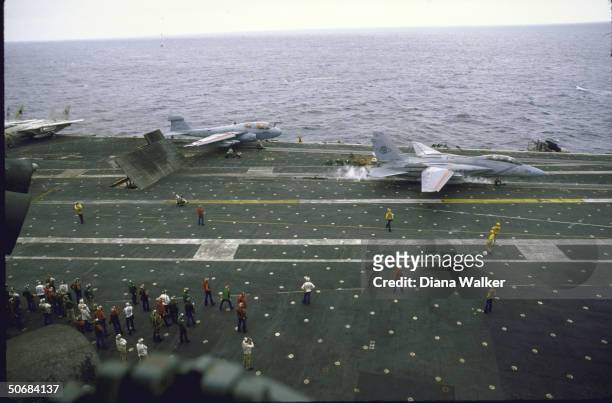 Unidentified planes and air controllers on flight deck of USS America off coast of Ocean City.