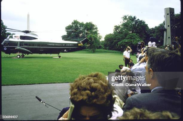 Press reporters and photographers on hand with Marine One helicopter in view as Pres. Ronald W. Reagan arrives home from Indianapolis.