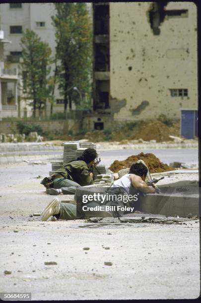 Druse PSP, , militiamen take cover from sniper fire at Barbir section of museum Green Line crossing between W/E Beirut, during internecine fighting.