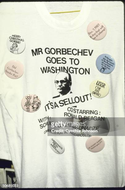 Ronald W. Reagan-Mikhail S. Gorbachev summit buttons and t-shirt souvenirs, featuring cariacatures of the US and Soviet leaders and snippy, often...