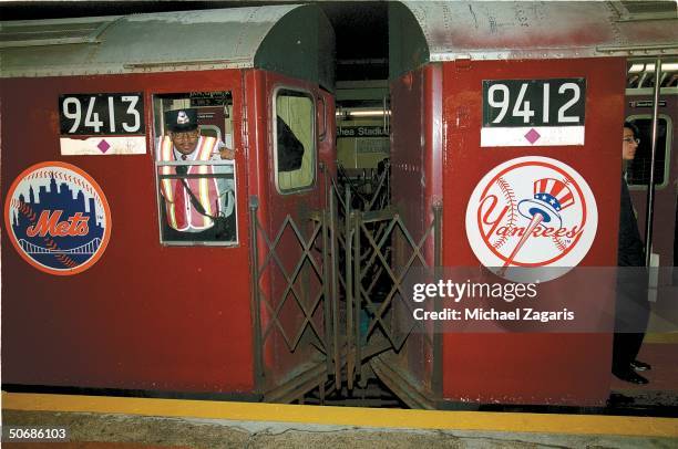 Baseball: Feature. Portrait of number 7 subway train with New York Mets and New York Yankees logos as it pulls into Willets Point Shea Stadium...