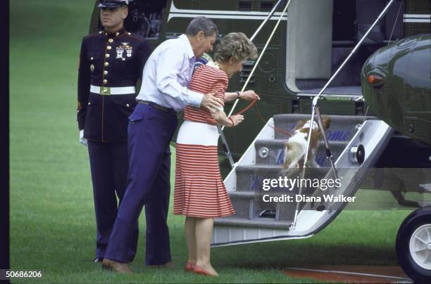 President Ronald W. Reagan, his wife Nancy, and their dog boarding Marine One copter ONTHEIR WAY TO cAMP dAVID.