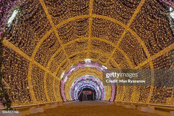 christmas decoration of moscow - christmas light tunnel stock pictures, royalty-free photos & images