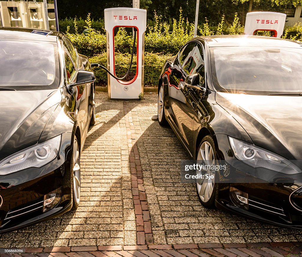 Tesla Model S electric cars at a supercharger charging station