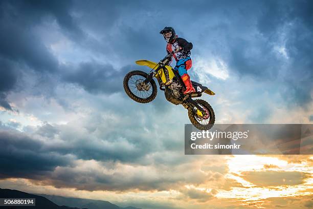 motorbike riding - motorcycle stunt stock pictures, royalty-free photos & images