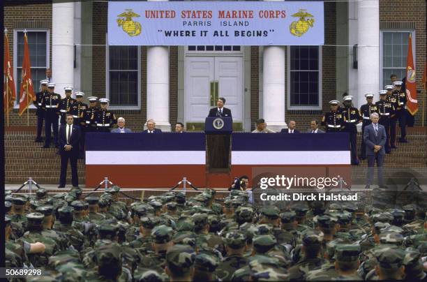 Pres. Ronald W. Reagan addressing graduating class at Parris Island Marine Corps Training Center flanked by Senators Ernest F. Hollings and J. Strom...