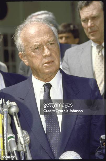 Israeli Defense Minister Itzhak Rabin talking to press after signing SDI agreement, with Assistant State Secretary Richard Murphy in rear.