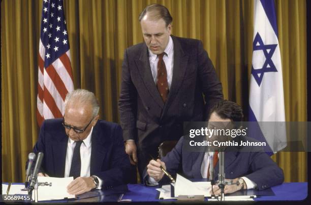 Israeli Defense Minister Itzhak Rabin and Defense Secretary Casper W. Weinberger signing SDI agreement, making Israel the third nation to join Star...