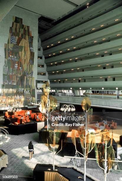 Interior of the Contemporary Resort Hotel's Grand Canyon Concourse lobby, whose ceiling is 14 stories high and has a monorail terminal , at Disney...