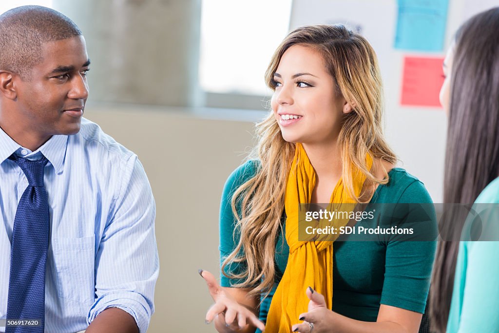 Teenage Hispanic girl talks in group therapy