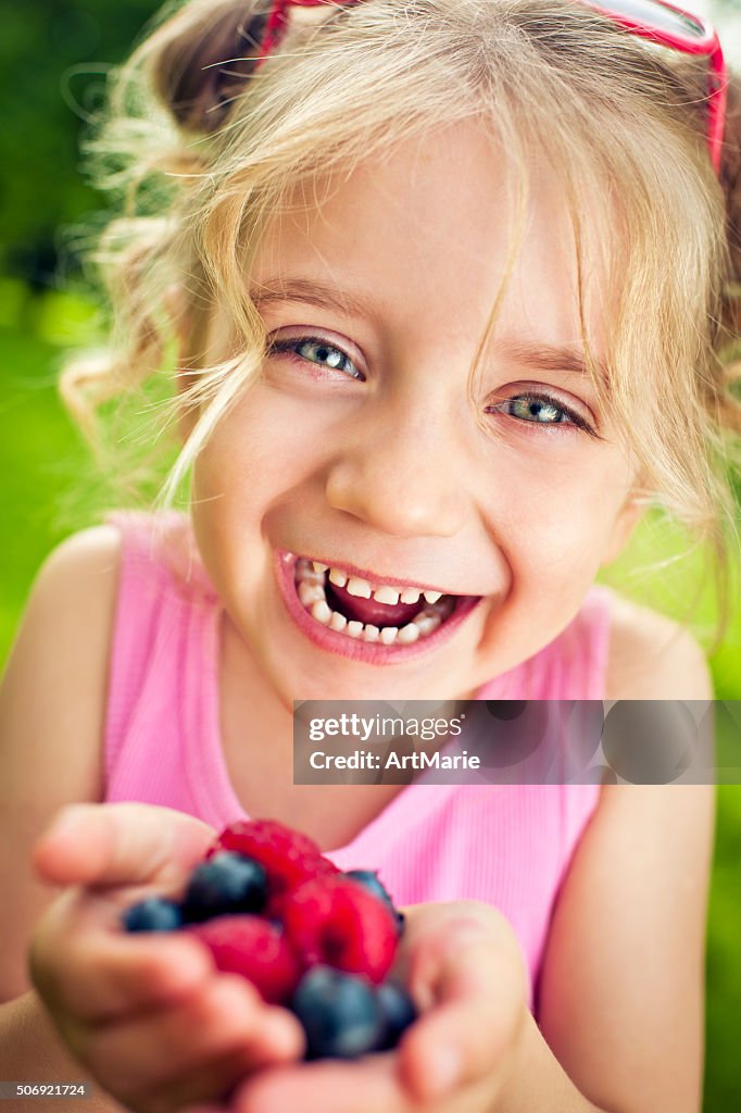 Child with berries