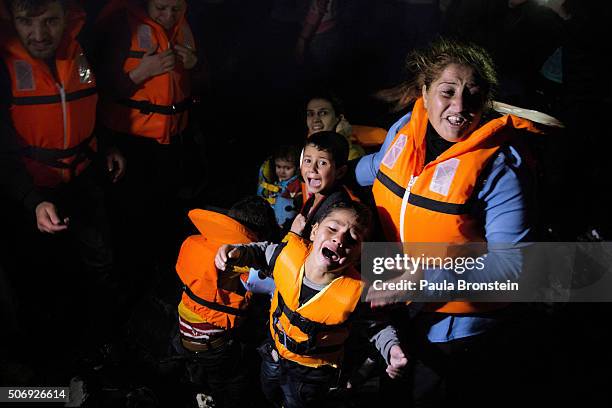 Refugees traumatized by their journey at night arrive scared but safe in Lesbos on October 28, 2015. Cold weather and rough seas have done little to...