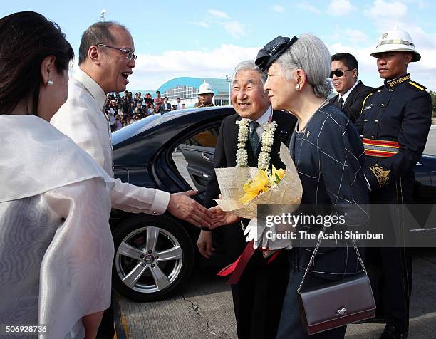 Emperor Akihito and Empress Michiko are welcomed by Philippines President Benigno Aquino and his sister Aurora Corazon Aquino-Abellada at the Ninoy...