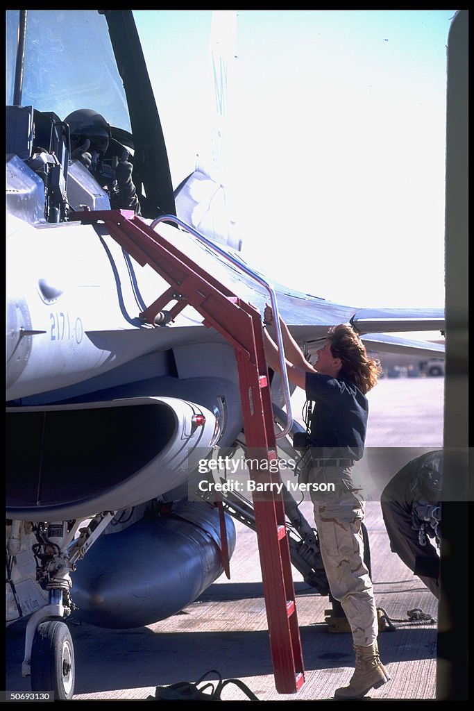 Flight prep ground crewwoman conferring