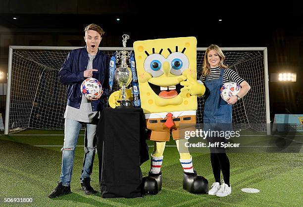 Roman Kemp Spongebob Squarepants and Rachel Stringer pose for a photo with the Champions League cup as 15 mascots from The Football League, take part...