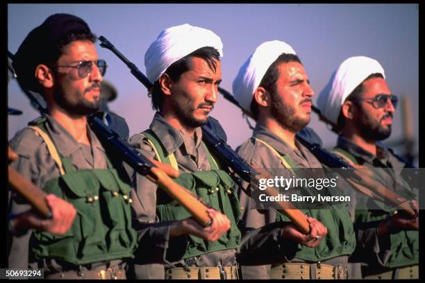 Revolutionary Guard soldiers incl. Basidjis, Islamic volunteers, in their midst marching in military parade kicking off sacred defense week...