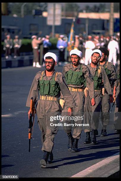 Revolutionary Guard soldiers incl. Basidjis, Islamic volunteers, in their midst marching in military parade kicking off sacred defense week...