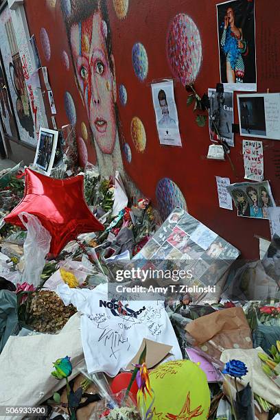 Flowers, letters and other items left on a mound continue to grow two weeks after the death of Brixton born English singer, songwriter David Bowie at...