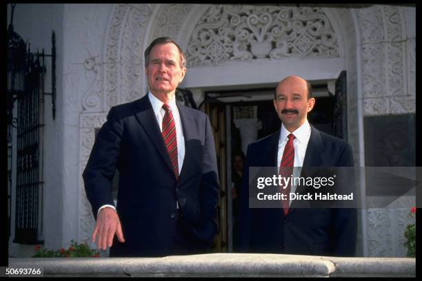 Presidents George Bush & Carlos Salinas de Gortari poised on veranda during drug summit.