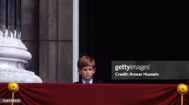 Young Prince Harry peeps over the balcony at Buckingham Palace during Trooping the Colour on June 17, 1989 in London, England.