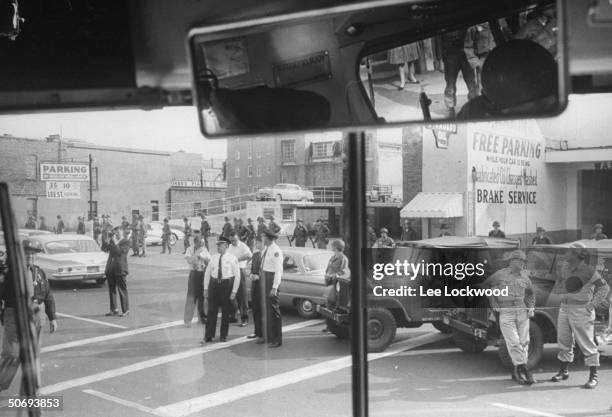 National Guardsmen and Mississippi showing strong presence as viewed through bus window as Freedom Riders make stop on bus trip from Montgomery,...