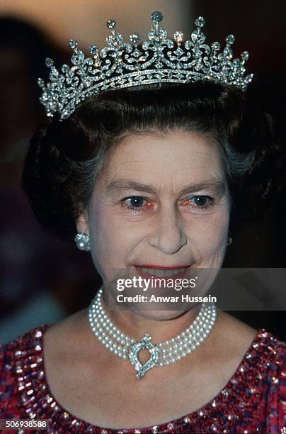 Queen Elizabeth II wears a four strand diamond and pearl choker with 'Granny's Tiara' to a banquet in Bangladesh on November 16, 1983 in Bangladesh.