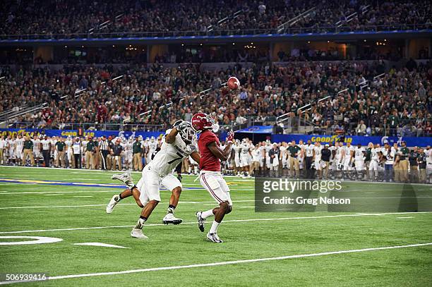 Cotton Bowl: Alabama Calvin Ridley in action, making 50-yard catch over Michigan State Demetrious Cox during 1st half of College Football Playoff...