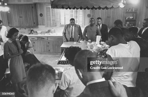 Rev. Ralph Abernathy participating in prayers prior to Freedom Riders' bus trip from Montgomery, Alabama to Jackson, Mississippi.