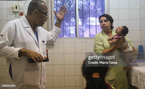 Oswaldo Cruz Hospital staff prepare to draw blood from baby Lorrany Emily da Silva , who has microcephaly, on January 26, 2016 in Recife, Pernambuco...