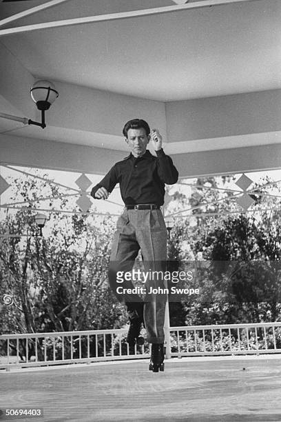 Actor Donald O'Connor dancing on roller skates, probably in preparation for filming of I Love Melvin.