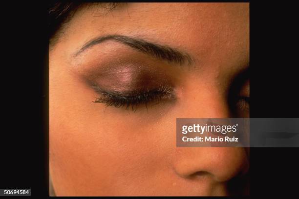 Closeup of model's closed eyelid w. Roach eyeshadow by Urban Decay cosmetics company.