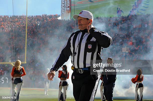 Referee Ed Hochuli walks onto the field before the AFC Championship game between the Denver Broncos and the New England Patriots at Sports Authority...
