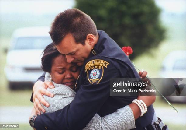 Oklahoma City Police Officer Jim Ramsey embracing co-worker Vickie Thomas at funeral for fellow officer Terry Yeakey who committed suicide 4 days...