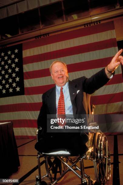 Vietnam War veteran triple amputee Max Cleland pointing as he delivers speech in wheelchair during Dem. Senatorial campaign appearance