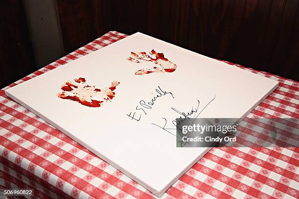 Famed mentalist The Amazing Kreskin has his handprints immortalized in marinara sauce at Buca di Beppo Times Square on January 26, 2016 in New York...