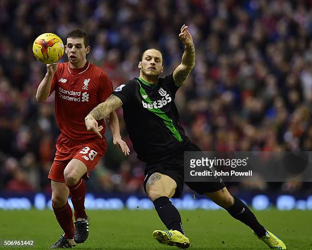 Jon Flanagan of Liverpool tussles with Marko Arnautovic of Stoke City during the Capital One Cup Semi Final: Second Leg between Liverpool and Stoke...