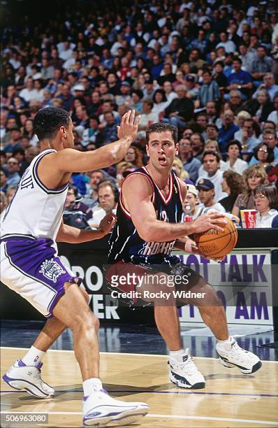 Matt Maloney of the Houston Rockets drives against the Sacramento Kings circa 1997 at Arco Arena in Sacramento, California. NOTE TO USER: User...