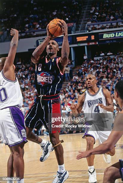 Eddie Johnson of the Houston Rockets shoots against the Sacramento Kings circa 1997 at Arco Arena in Sacramento, California. NOTE TO USER: User...